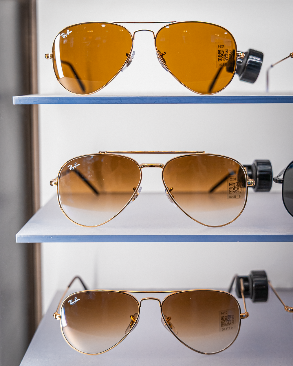 Three different types or Ray Ban Aviator on a shelf